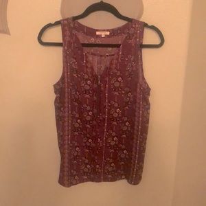 Burgundy print sleeveless blouse. Size L 100% poly